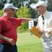 Tom Paup, of Ann Arbor, playfully jabs trickster Ken Magee on the shoulder after a card trick during the Judy Fike Annual Golf Outing "Tee it Up to Make a Difference for Ann Arbor Meals on Wheels!" on Monday morning. Melanie Maxwell I AnnArbor.com